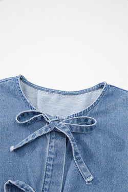 Twilight blue denim shirt tied on the front with bubble and basque sleeves