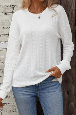 White textured knit top with crew neck and dropped shoulders