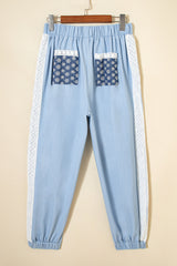 Pantalon ample plissé à jambe large et poche plaquée florale