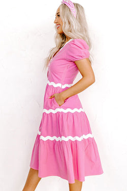 Mid-length fluid dress with short puffing sleeves and candy ric rac border