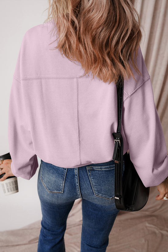 Dropped shoulder sweatshirt with batwing sleeves and exposed seams and orchid petals