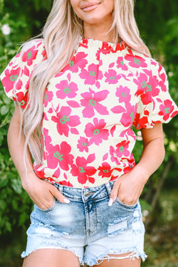 Blusa beige con flores y mangas hinchadas *