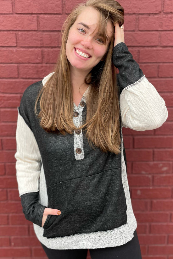 Black textured buttoned hoodie with kangaroo pocket color block