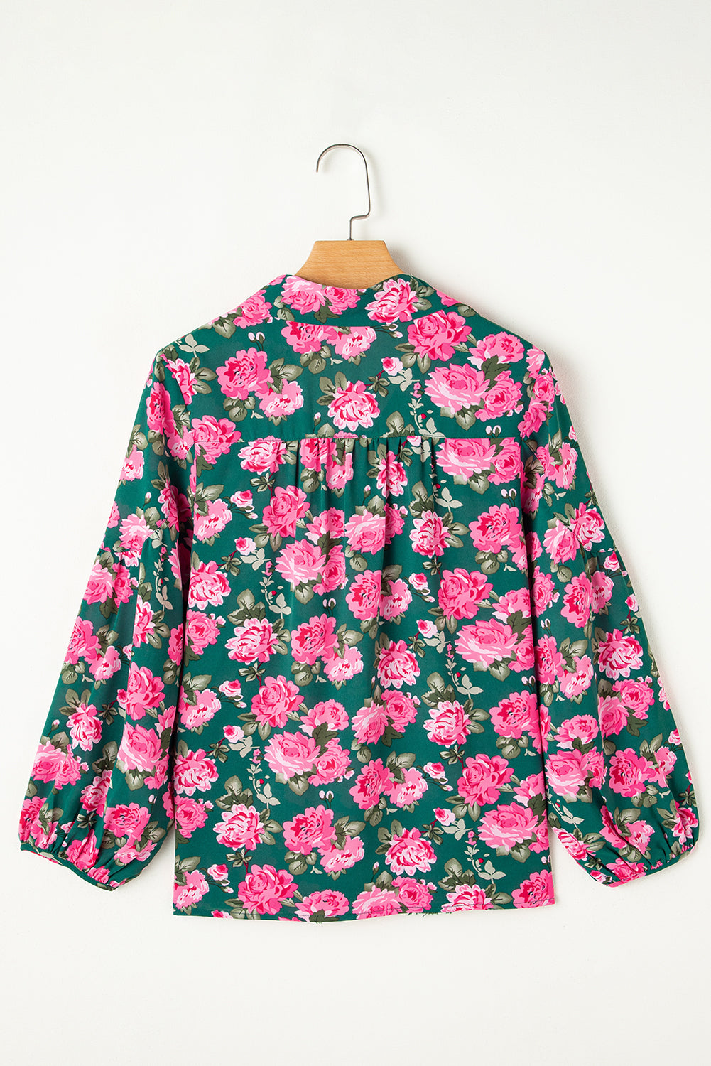 Green blouse with puffy sleeves and tied collar with floral print *