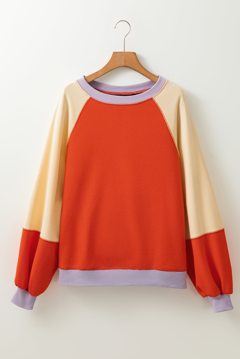 Orangefarbene Farbblockseite schlägt Raglan -Ärmel lous Fit Top