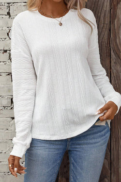 White textured knit top with crew neck and dropped shoulders