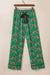 Green pajama set with short sleeve shirt and cheetah print pants