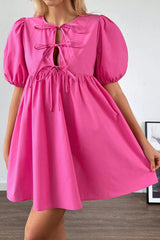 Mini-robe rose vif à manches bouffantes *