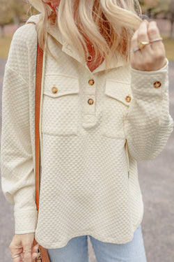 Apricot textured hoodie with button-down neckline and side pockets