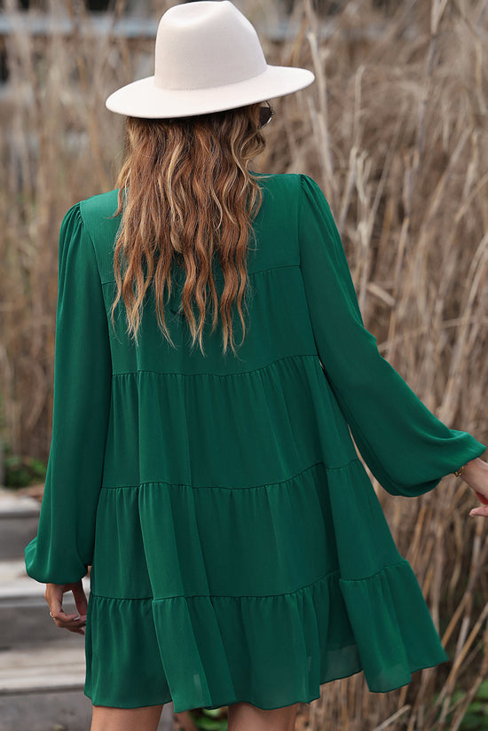 Vestido verde con volantes y mangas hinchadas *