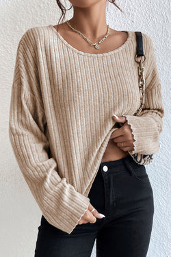 Loose ribbed knit top with dropped shoulders and cuffs in beige lettuce