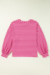 Striking pink sweatshirt and neck and falling shoulders