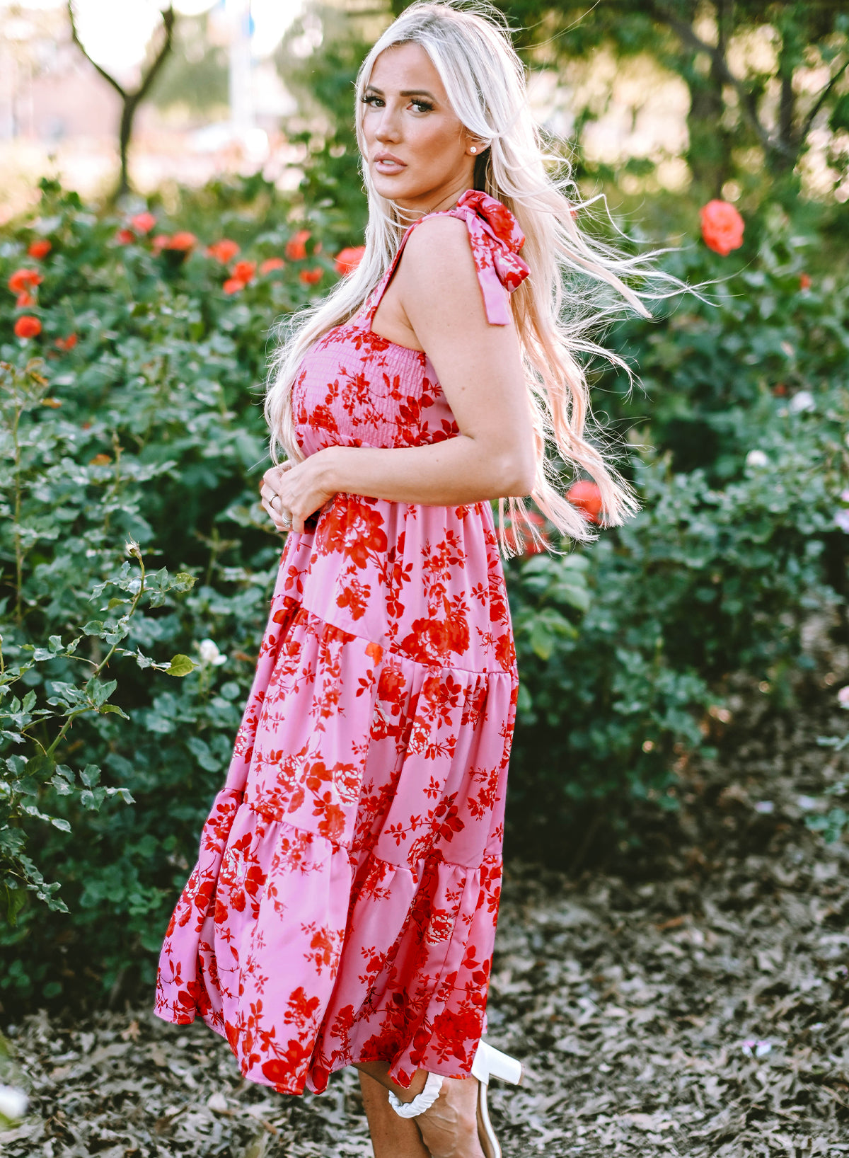 Pink floral dress with ruffles and tied straps