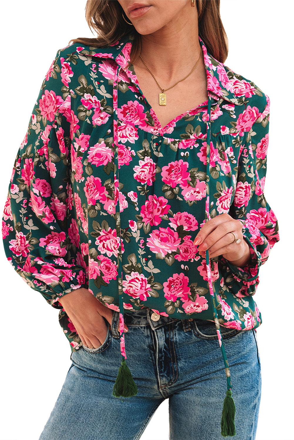 Green blouse with puffy sleeves and tied collar with floral print *