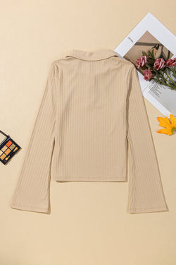 High beige buttoned collar and long sleeves, slim cut