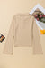 High beige buttoned collar and long sleeves, slim cut