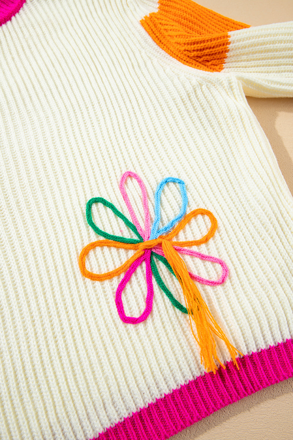 Pull ample en tricot torsadé à imprimé floral color block beige