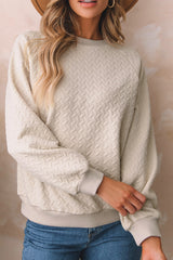 Sudadera beige texturizada une con manga raglán