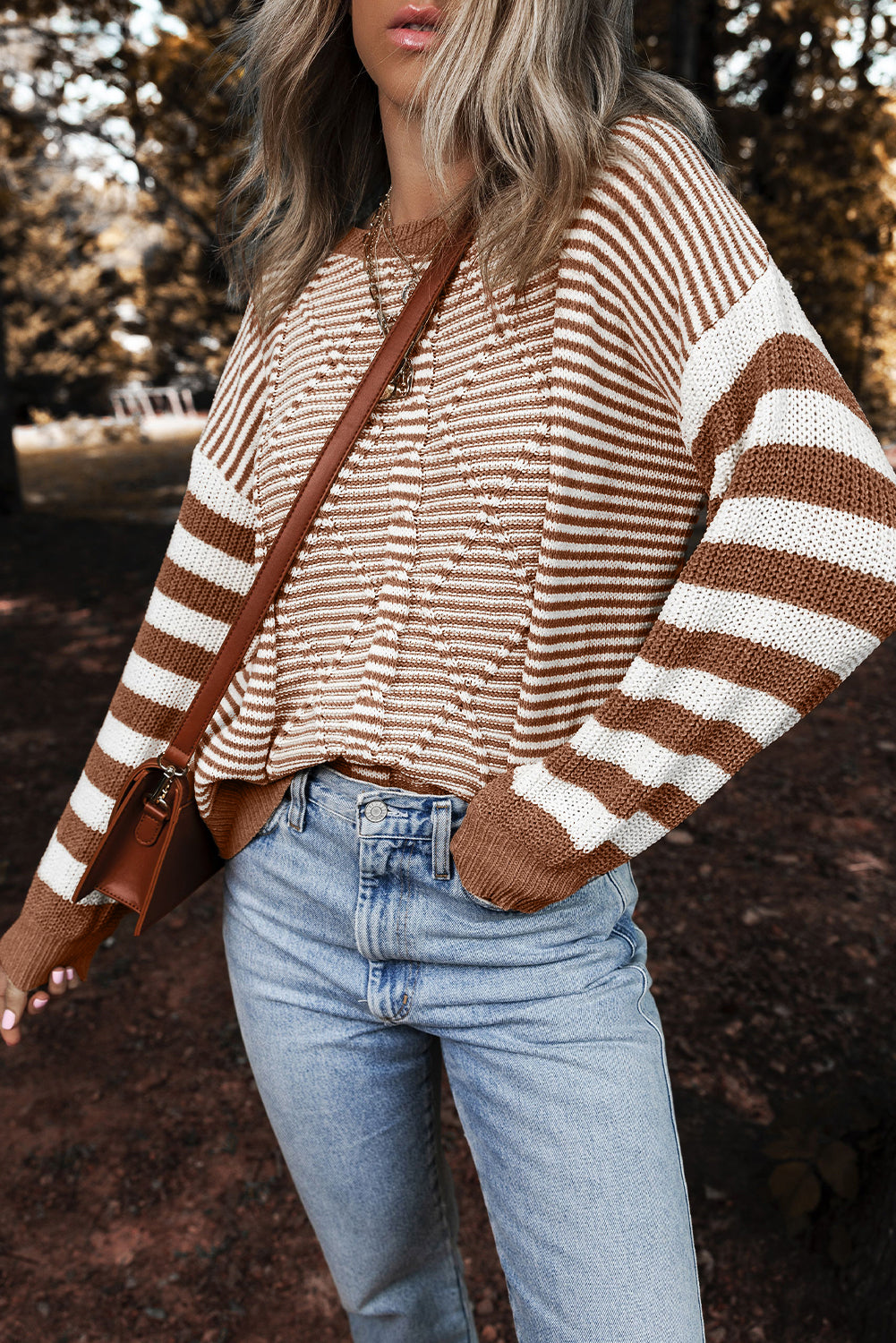 Brown sweater with textured geometric stripes and dropped shoulders