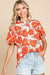 Orange loose sleeve blouse and flying collar and floral pattern