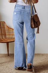 High blue flared jeans faded with acid with raw hem