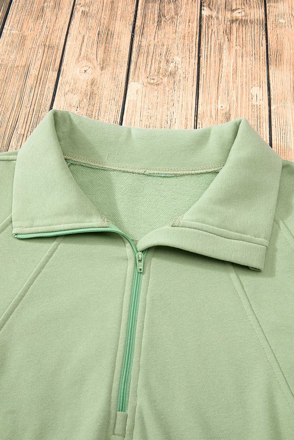 Smoke green sweatshirt with kangaroo pocket and stand-up collar with quarter zip
