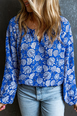Chemisier bleu à manches longues et col en V cranté à fleurs-A WOMAN WE LOVE