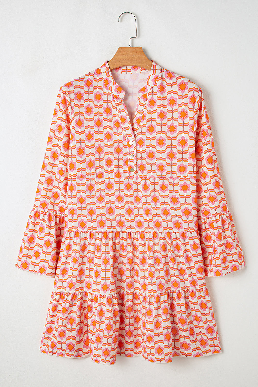 Orange floral print mini dress with ruffle sleeves and button front