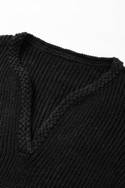 Black knitted sweater with puff sleeves and braided notched V-neckline