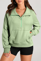 Smoke green sweatshirt with kangaroo pocket and stand-up collar with quarter zip