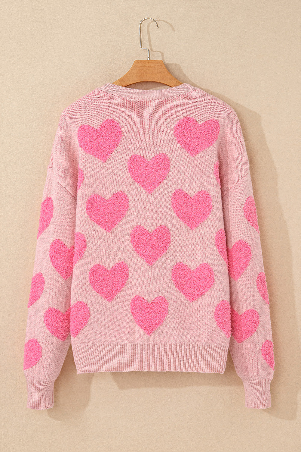 Pull en tricot de coeur de la Saint-Valentin rose clair