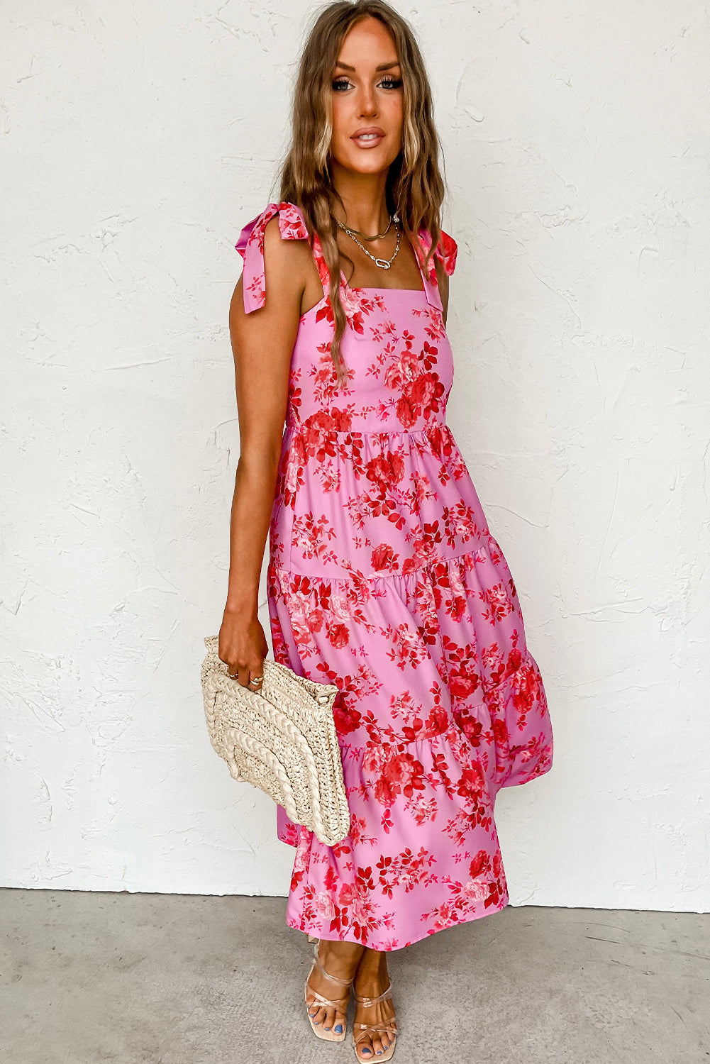 Pink floral dress with ruffles and tied straps