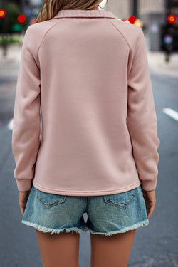 Pale chestnut textured sweatshirt with raglan sleeves and zipper on a quarter