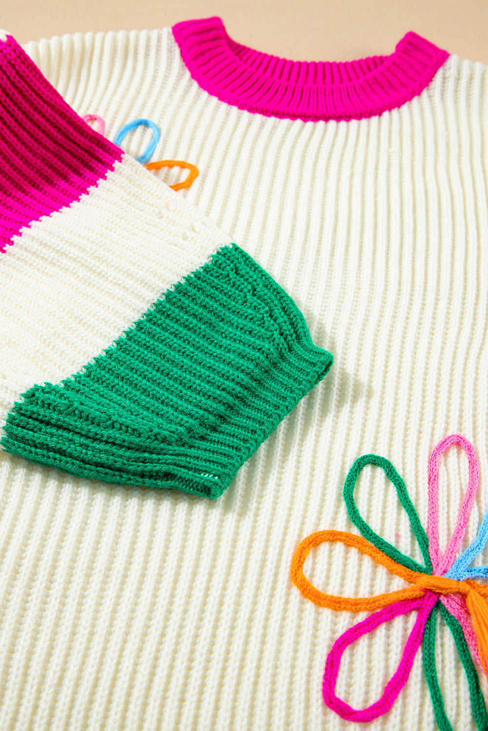 Pull ample en tricot torsadé à imprimé floral color block beige