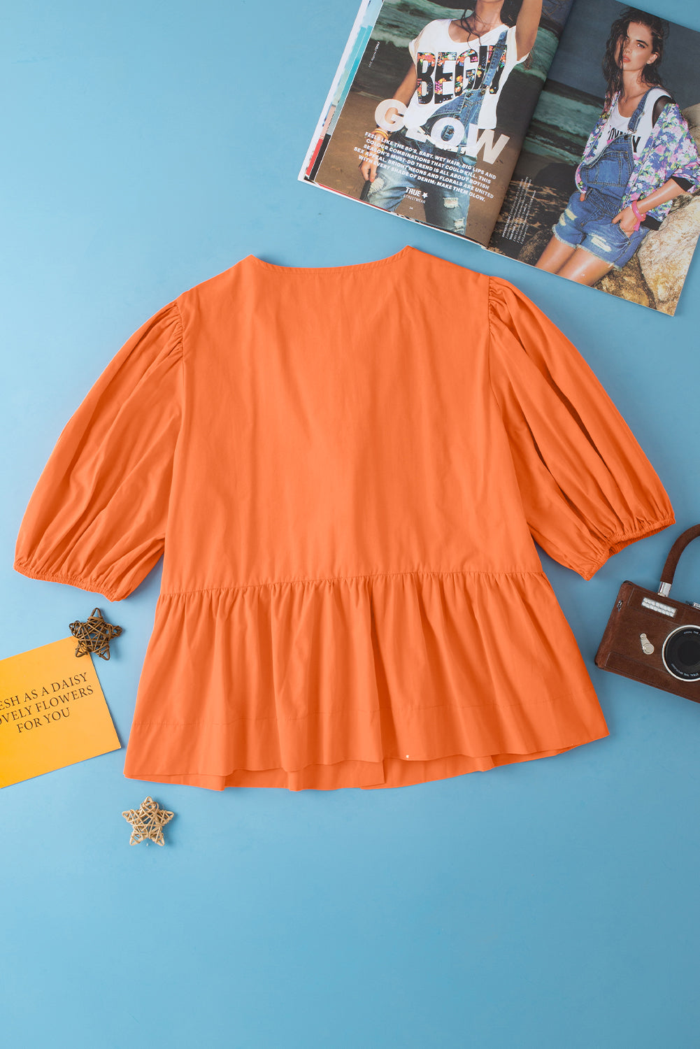 Blouse à peplum à manches courtes nouées orange nouée à l'orange nouée