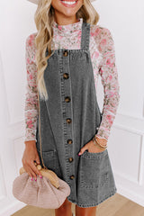 Mini-robe en jean gris moyen à larges bretelles boutonnées avec poches sur le devant