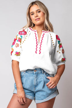 White textured blouse with puffy sleeves and Ricrac floral embroidery