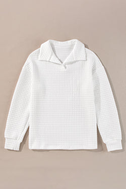 White long sleeve top with sporty collar and quilted texture