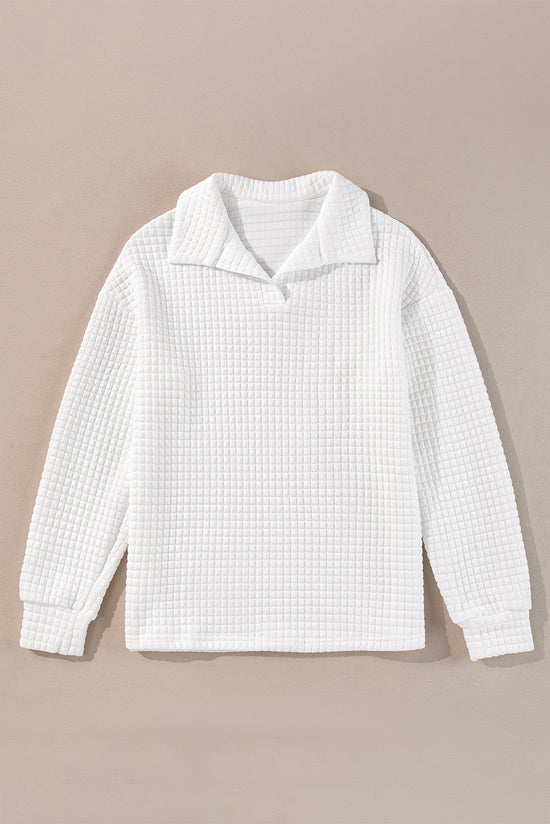 White long sleeve top with sporty collar and quilted texture