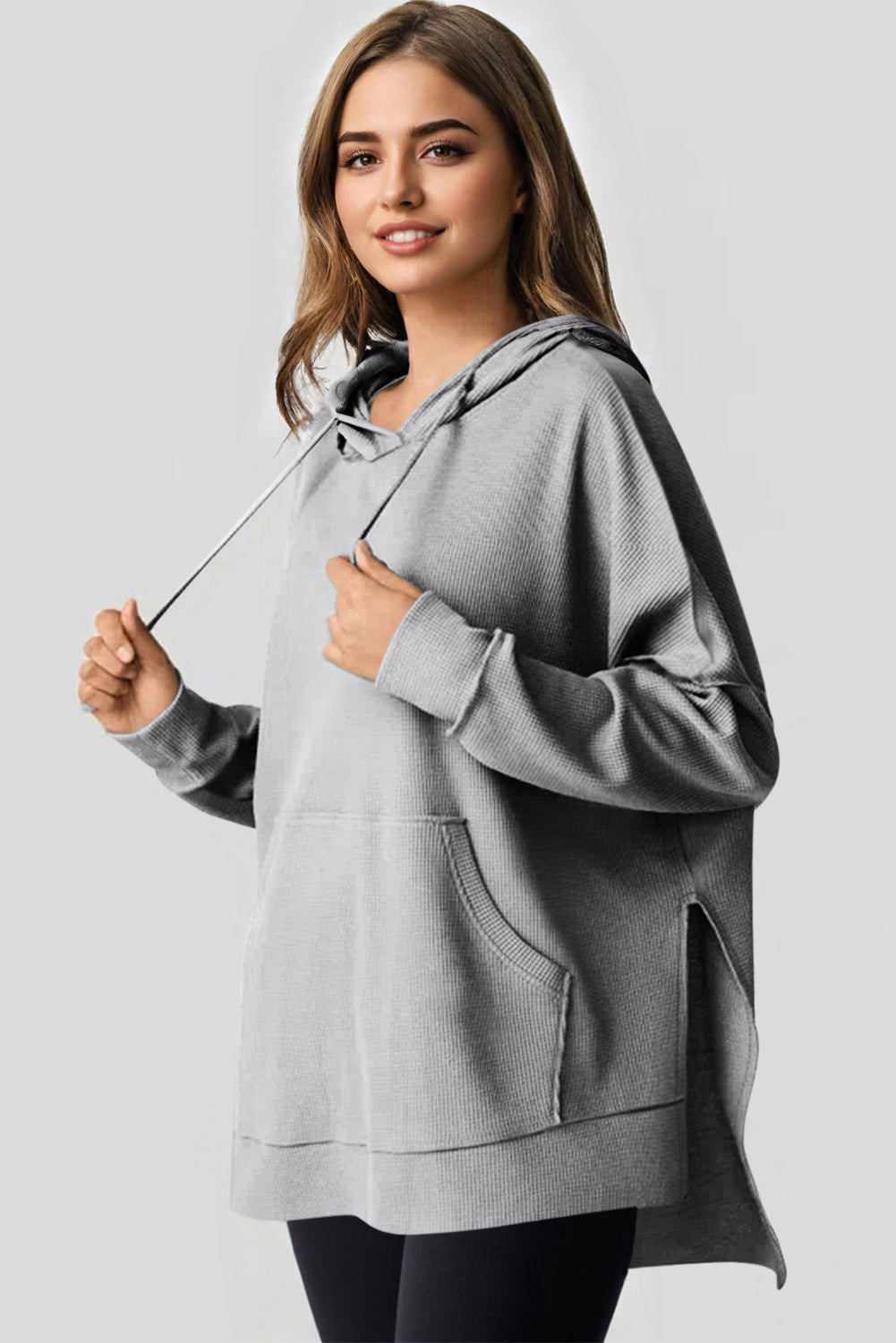 Sweat à capuche surdimensionné haut bas gris en tricot gaufré doublé de polaire