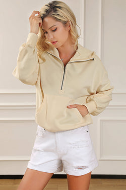 Beige zip-up hoodie with kangaroo pocket and ribbed trim