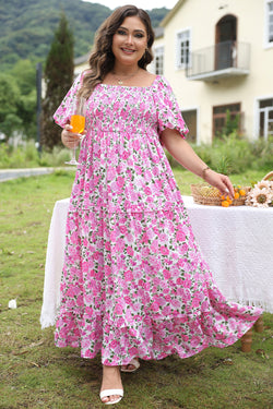 Vestido rosa con mangas hinchadas y estampado floral grande