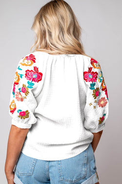 White textured blouse with puffy sleeves and Ricrac floral embroidery