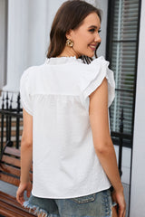 White top with ruffles and floating sleeves with notch collar