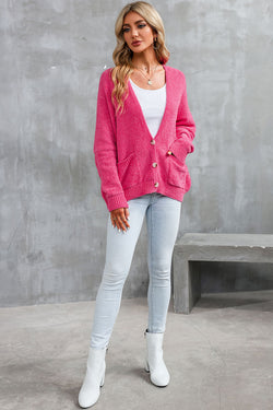 Cardigan pull avec poches sur le devant et boutons roses