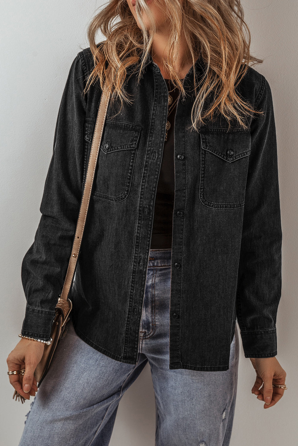 Black denim jacket with collar and buttons with flap pocket