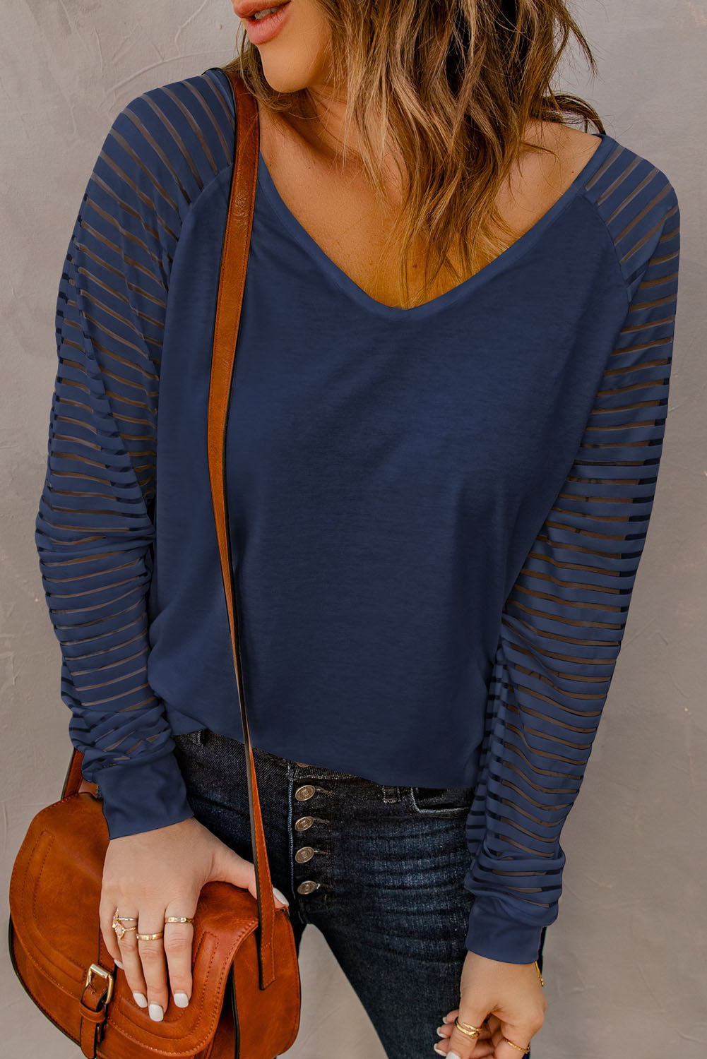 Blue V-neck top with sheer stripes