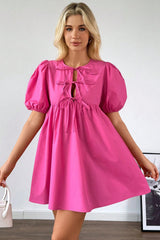 Mini-robe rose vif à manches bouffantes *