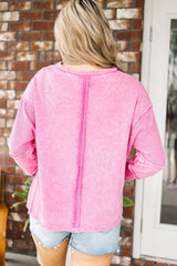Pink sweatshirt with raw edges, exposed seams, up and down