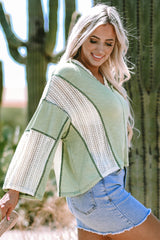 Grass green high low loose top with crochet details and exposed seams